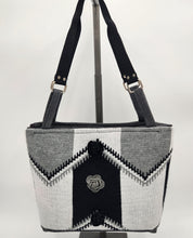 Load image into Gallery viewer, handmade knitted shoulder bag
black and gray tote purse
floral accent handbag
unique boutique bag
knitted geometric purse
durable everyday tote