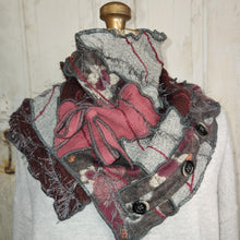 Load image into Gallery viewer, A handmade, multi-layered ruffled scarf or shawl displayed on a mannequin torso. The scarf features layers of dusty pink, burgandy, and gray fabric with decorative buttons