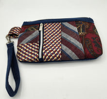 Load image into Gallery viewer, upcycled tie clutch, handmade wristlet bag, eco friendly purse, patchwork clutch bag, vintage tie handbag, recycled fabric purse, sustainable fashion accessory, unique evening clutch, quirky handmade gifts, zero waste fashion, zipper wristlet wallet


