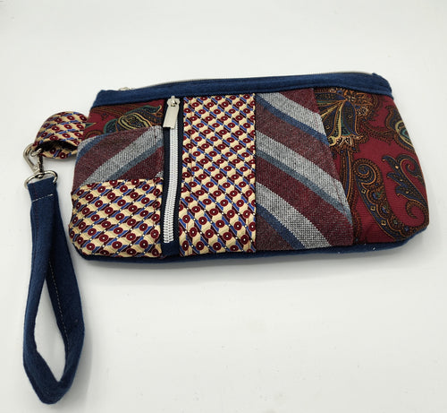 upcycled tie clutch, handmade wristlet bag, eco friendly purse, patchwork clutch bag, vintage tie handbag, recycled fabric purse, sustainable fashion accessory, unique evening clutch, quirky handmade gifts, zero waste fashion, zipper wristlet wallet

